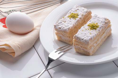 los angeles egg near the white ceramic plate milk cake